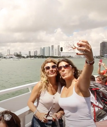 Two girls take a photo during the Sightseeing Cruises Miami.