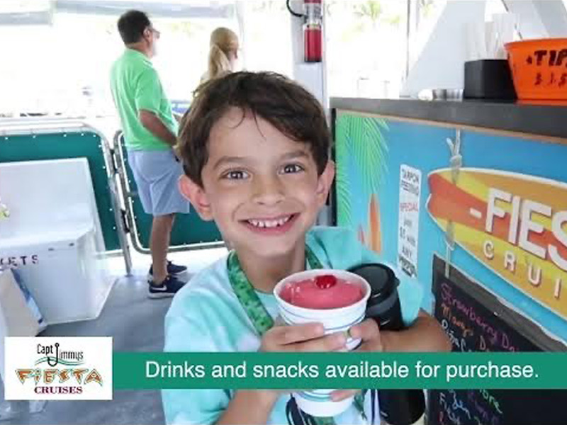 A young boy enjoys a smoothie and a snack from the cash bar during his tour. 